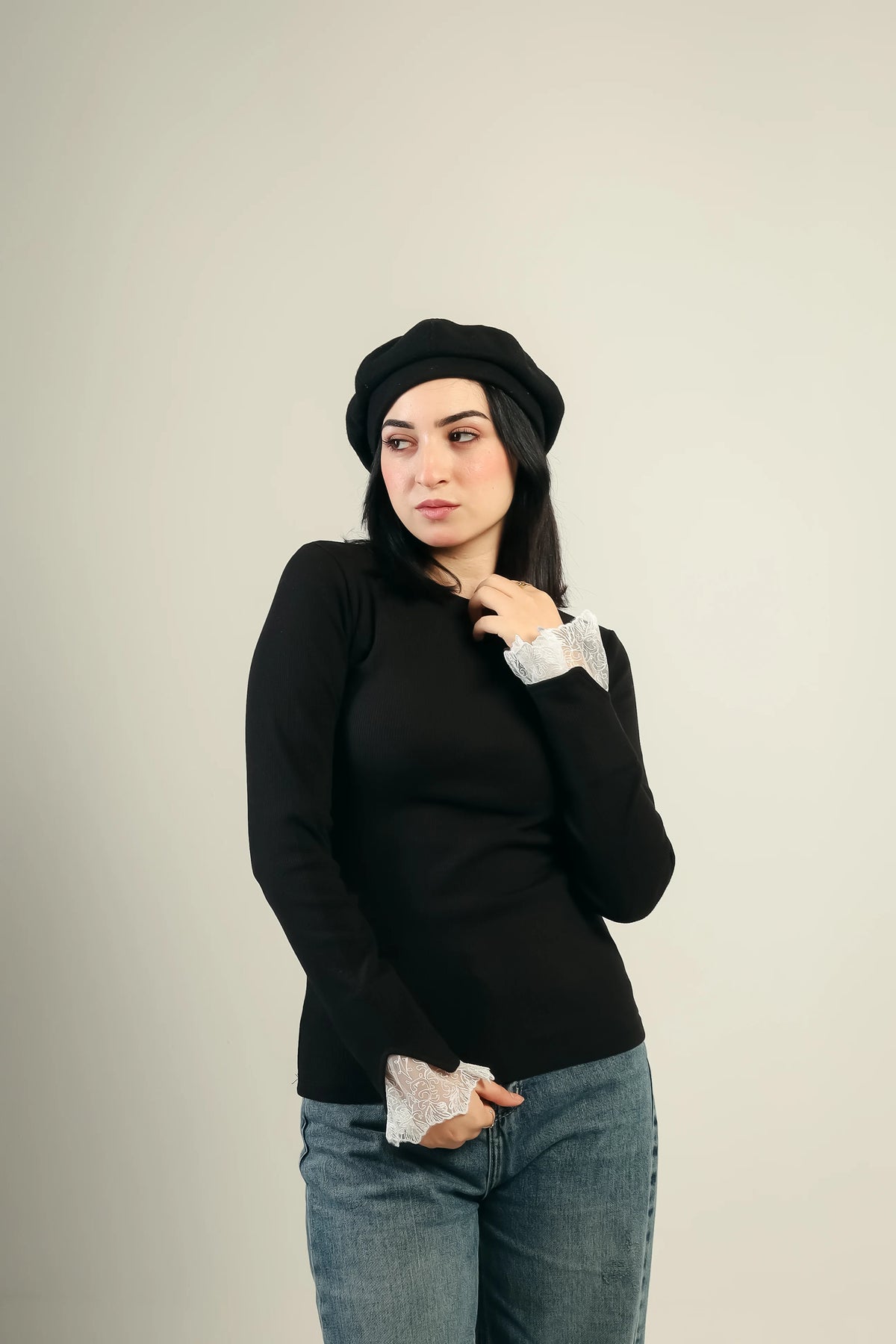 Gumus lace cuff ribbed top in black — three-quarter view showing the fitted rib