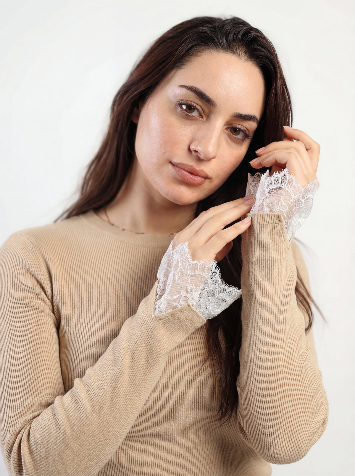Beige Gumus lace cuff ribbed top, lace cuff shown beside the face