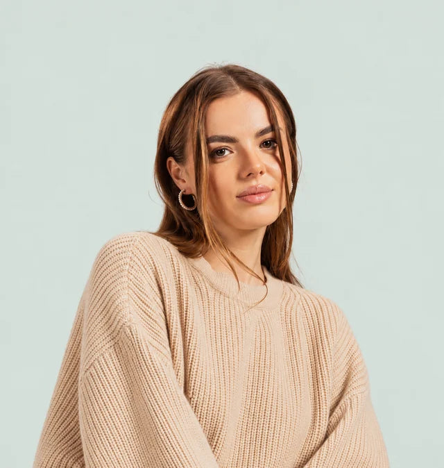GUMUS model wearing a soft beige knit